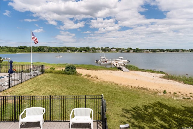 water view featuring fence and a boat dock