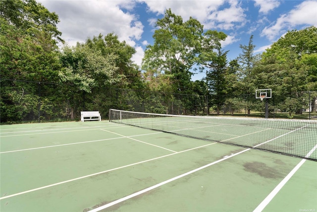 view of tennis court with fence