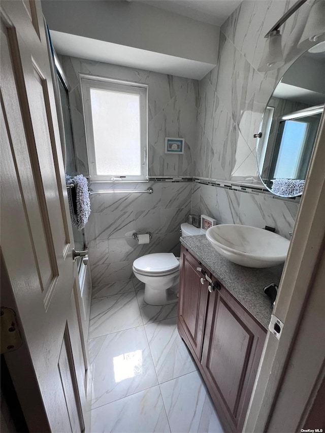 bathroom featuring marble finish floor, vanity, and toilet