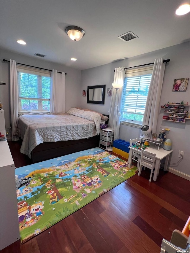 bedroom featuring recessed lighting, visible vents, baseboards, and wood finished floors