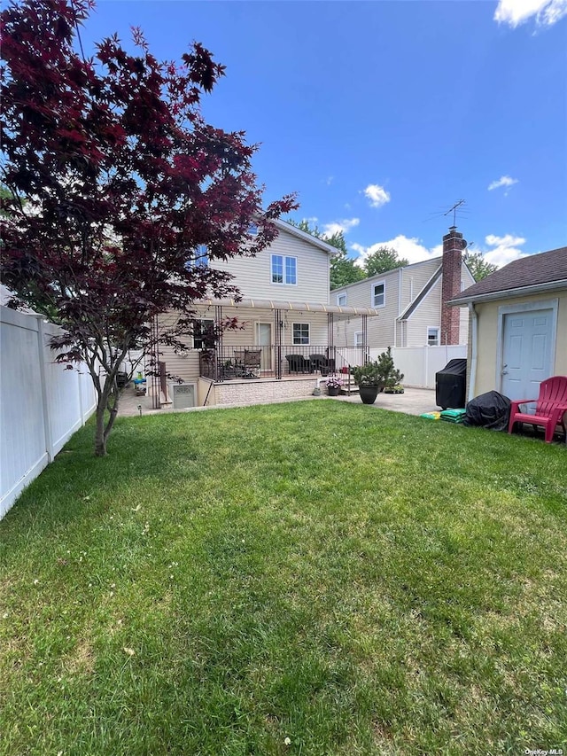 view of yard with a fenced backyard and a patio