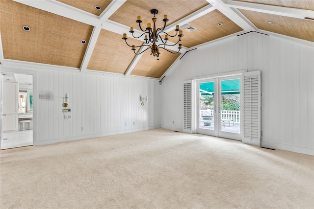 unfurnished living room featuring carpet, vaulted ceiling, wooden ceiling, french doors, and an inviting chandelier