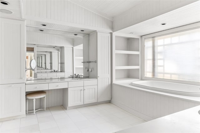 full bathroom featuring vanity and a bath