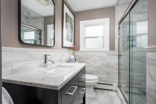 bathroom featuring a baseboard radiator, vanity, tile walls, and a shower stall