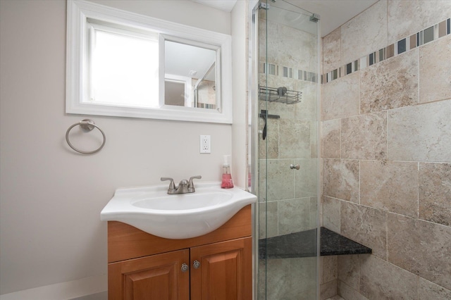 bathroom featuring vanity and a tile shower