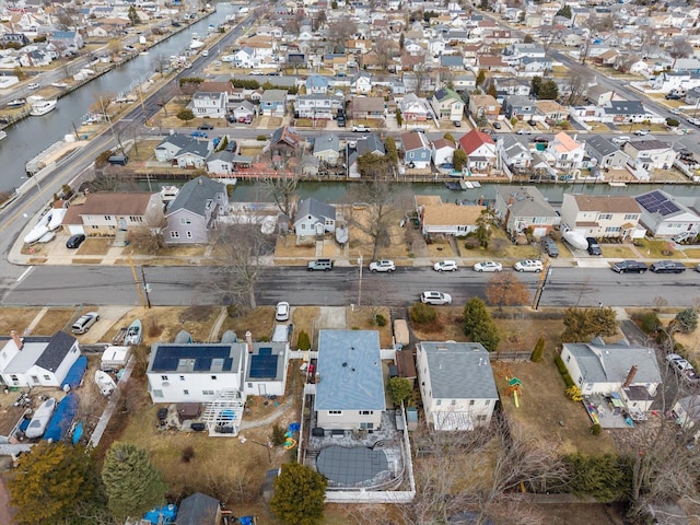 aerial view with a residential view and a water view