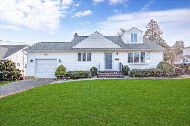 view of front of house with a garage, a shingled roof, a front yard, and aphalt driveway