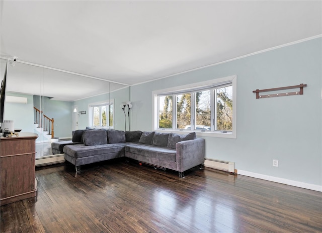 living area featuring stairway, crown molding, a baseboard heating unit, and dark wood-style flooring