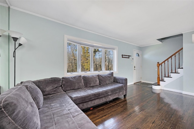 living area with hardwood / wood-style floors, stairway, baseboards, and ornamental molding