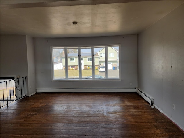 unfurnished room featuring a baseboard radiator, baseboards, and dark wood-style floors