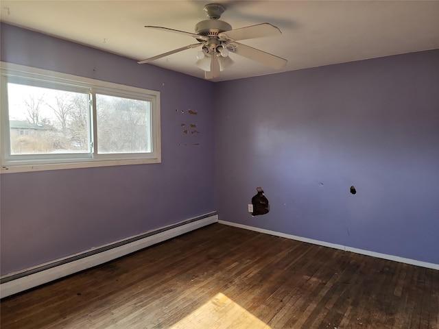 spare room with baseboards, wood-type flooring, baseboard heating, and a ceiling fan