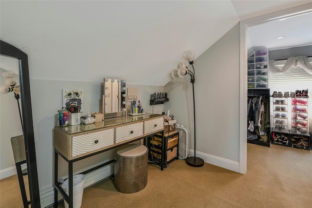 bathroom featuring baseboards and vaulted ceiling