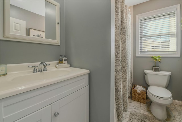 full bath with vanity and toilet