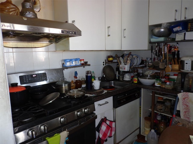 kitchen featuring stainless steel gas range oven, tasteful backsplash, ventilation hood, white cabinets, and dishwashing machine