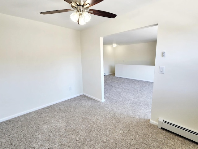 carpeted empty room with a ceiling fan, baseboards, and baseboard heating