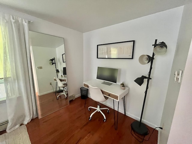 home office featuring baseboards, a baseboard radiator, and wood finished floors