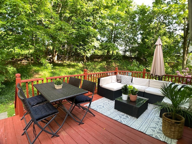 deck with outdoor dining space and an outdoor hangout area