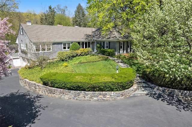 33 N Way, Chappaqua, NY 10514 - ranch-style house with a chimney, an attached garage, and driveway