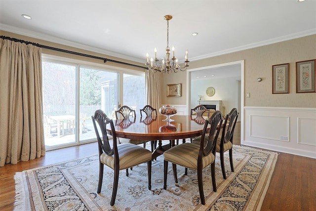 33 N Way, Chappaqua, NY 10514 - dining room with crown molding, an inviting chandelier, a wainscoted wall, recessed lighting, and wood finished floors
