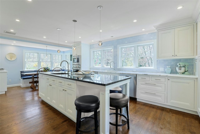 33 N Way, Chappaqua, NY 10514 - kitchen featuring white cabinets, appliances with stainless steel finishes, and a sink