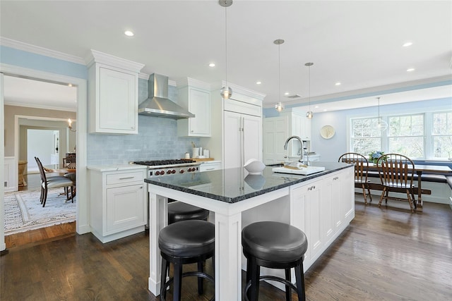 33 N Way, Chappaqua, NY 10514 - kitchen with wall chimney range hood, a sink, white cabinetry, dark wood-type flooring, and ornamental molding