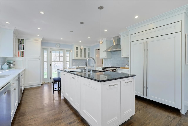 33 N Way, Chappaqua, NY 10514 - kitchen with glass insert cabinets, wall chimney range hood, tasteful backsplash, a sink, and dishwasher