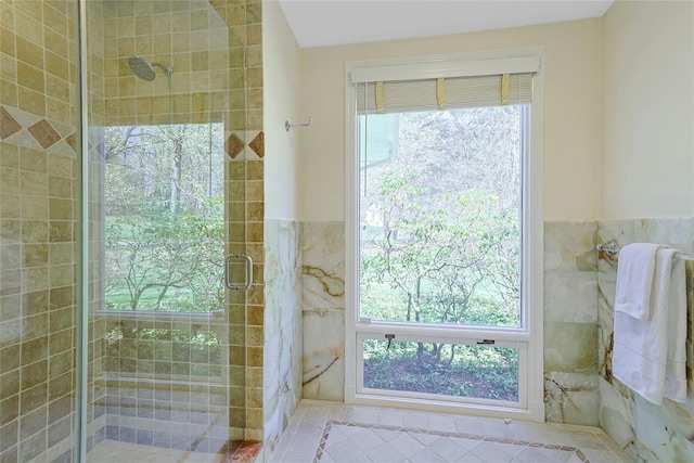 33 N Way, Chappaqua, NY 10514 - full bath featuring wainscoting, tile walls, a shower stall, and tile patterned flooring