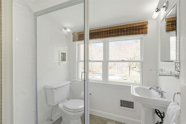 33 N Way, Chappaqua, NY 10514 - bathroom with toilet, baseboards, and visible vents