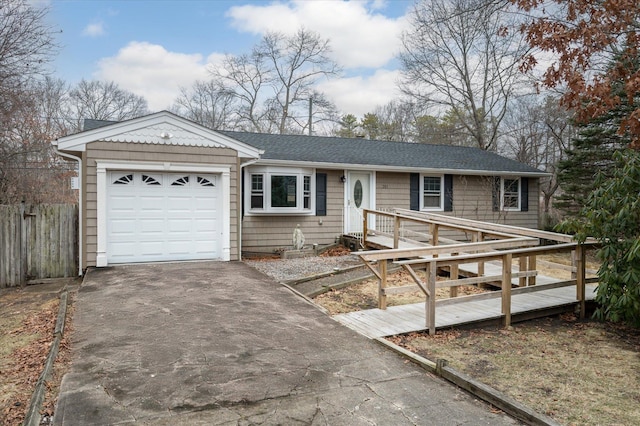 ranch-style home with a shingled roof, fence, aphalt driveway, a deck, and a garage