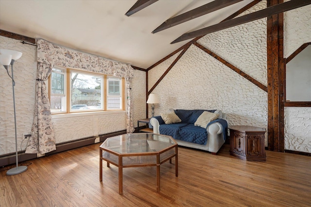 living room featuring vaulted ceiling with beams and wood finished floors