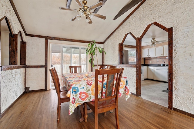 dining area with light wood-style flooring, ceiling fan, and ornamental molding