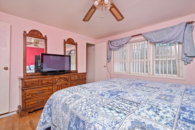 bedroom featuring ceiling fan and wood finished floors