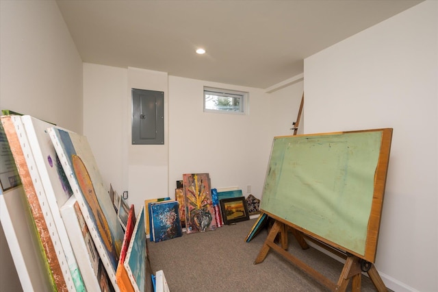 interior space with electric panel, recessed lighting, and carpet floors