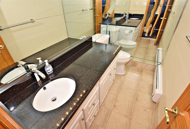 bathroom with vanity, tile patterned floors, and toilet