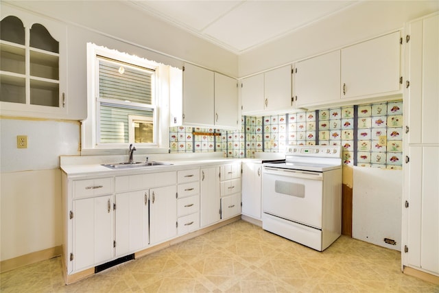 kitchen with white range with electric stovetop, white cabinets, light countertops, and a sink