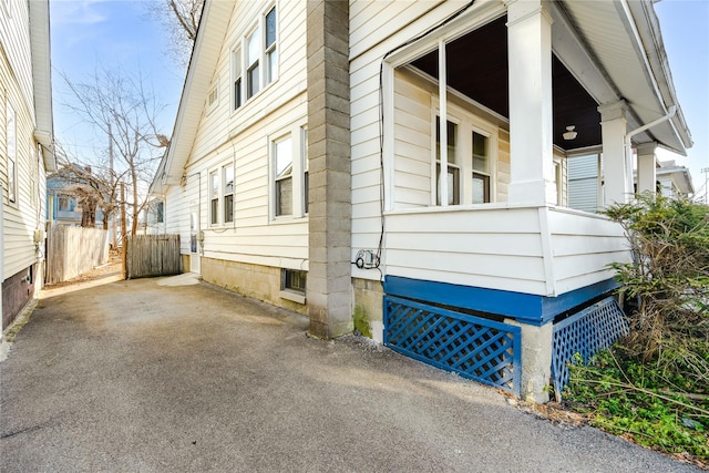 view of side of home with fence