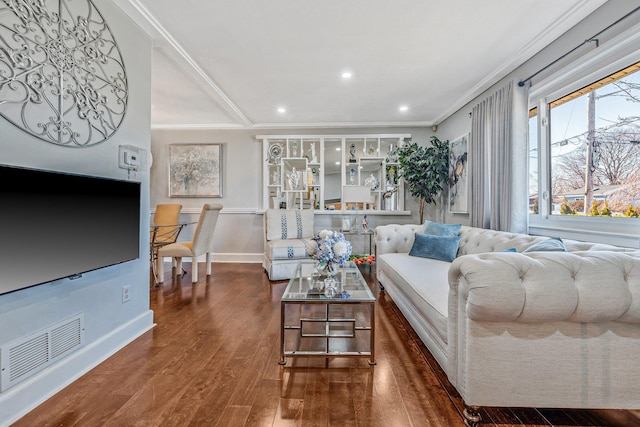 living room featuring visible vents, crown molding, baseboards, recessed lighting, and wood finished floors