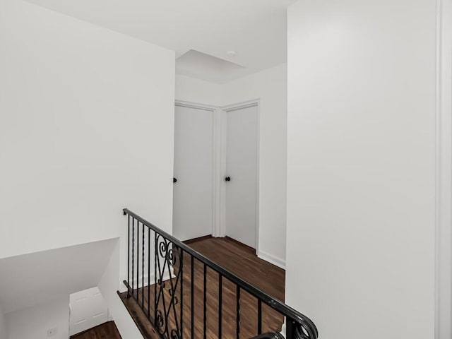 stairway with wood finished floors