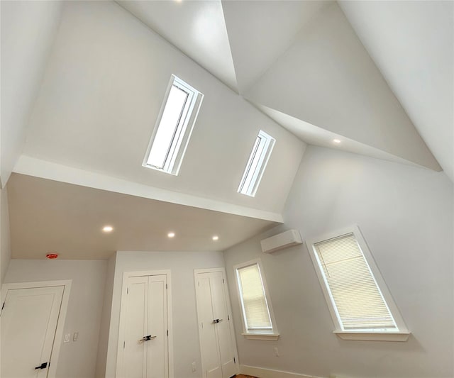 interior details featuring recessed lighting and a wall mounted air conditioner