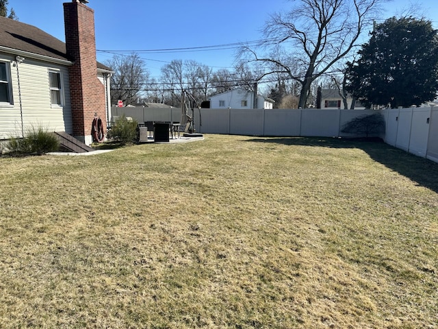 view of yard featuring a patio and a fenced backyard