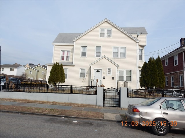 317 2nd Ave S, Mount Vernon, NY 10550 - townhome / multi-family property featuring a fenced front yard and a gate
