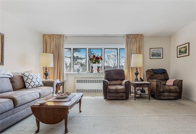 carpeted living area with ornamental molding and radiator heating unit