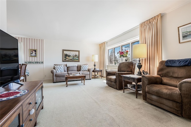 living area with light colored carpet and baseboards