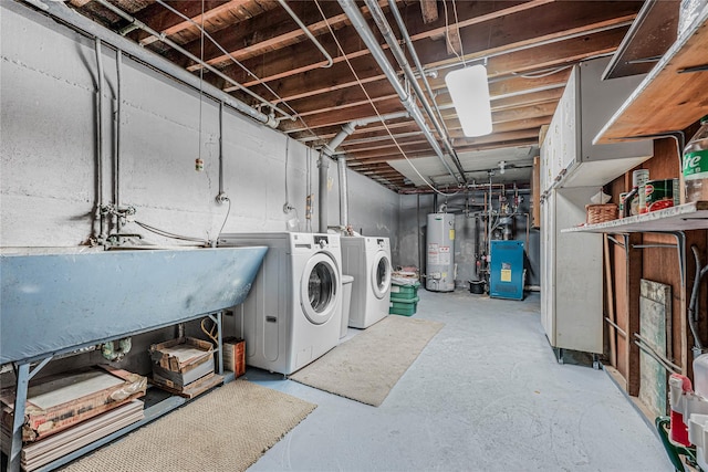 unfinished basement with washer and dryer, gas water heater, a heating unit, and a sink