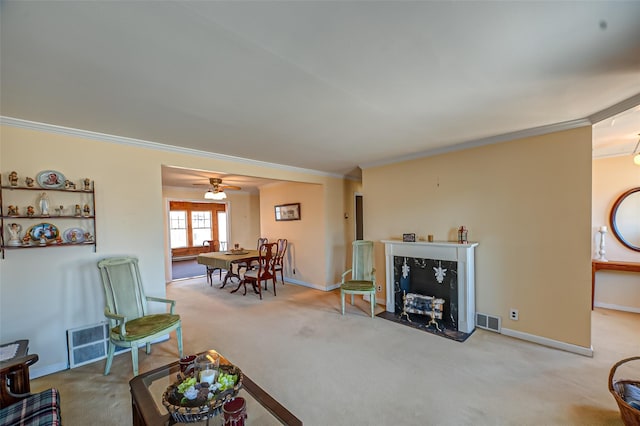 carpeted living room with visible vents, baseboards, and ornamental molding