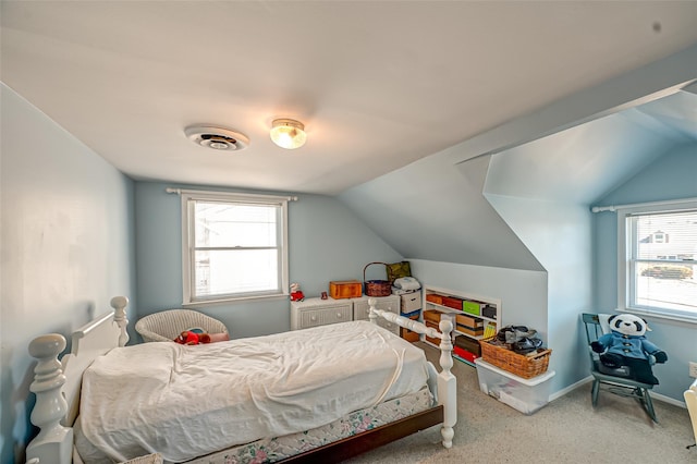 bedroom with visible vents, baseboards, and lofted ceiling