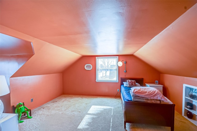 bedroom featuring carpet and lofted ceiling