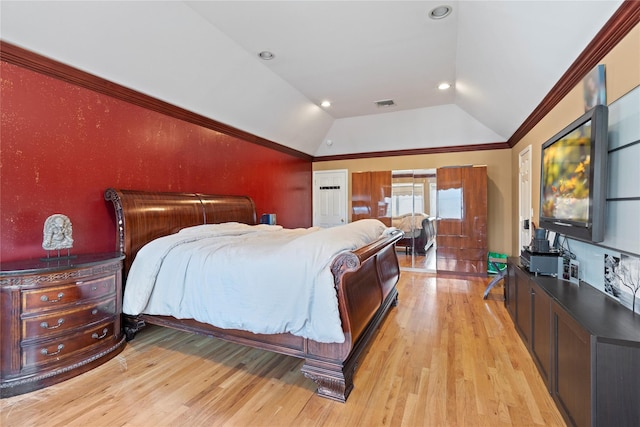 bedroom with visible vents, light wood finished floors, recessed lighting, vaulted ceiling, and crown molding