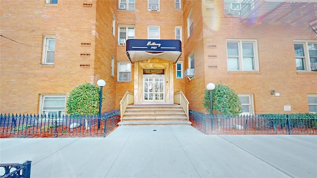 9425 Shore Rd Unit 6C, Brooklyn, NY 11209 - doorway to property with brick siding and fence