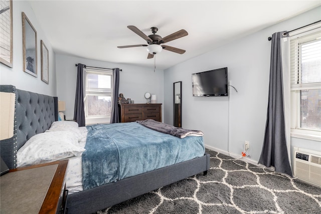 bedroom with a ceiling fan and baseboards